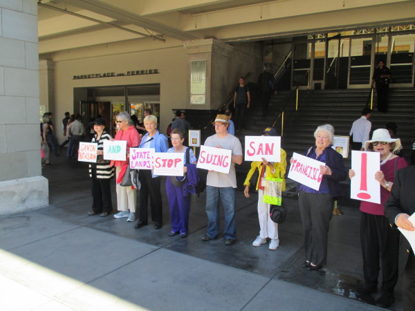 Protesters ask Newsom to call off the suit against SF