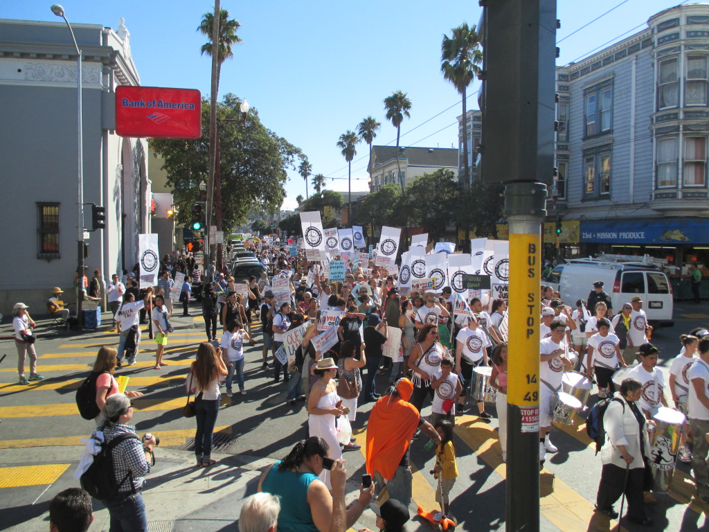 A rally against condos in the Mission took over half of Mission Street -- despite the hot weather and the Giants playoff game. Photos by Michael Redmond