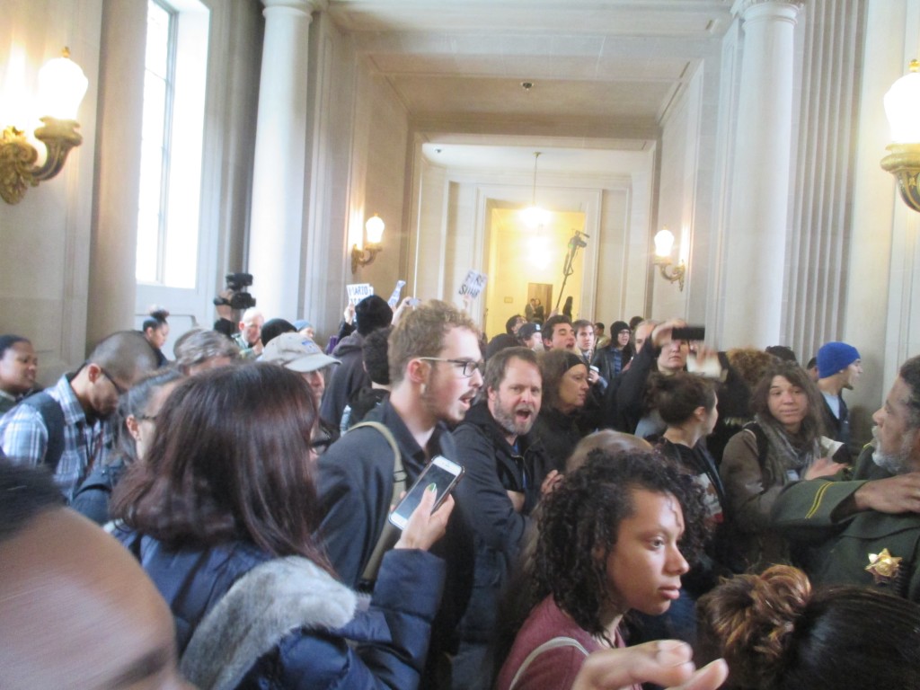 Protesters pack the second-floor balcony as Ed Lee is sworn in 