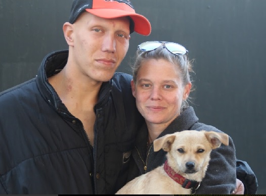 Heather Brown, 32, with Fiance Travis Perot, 34, and their dog Bella