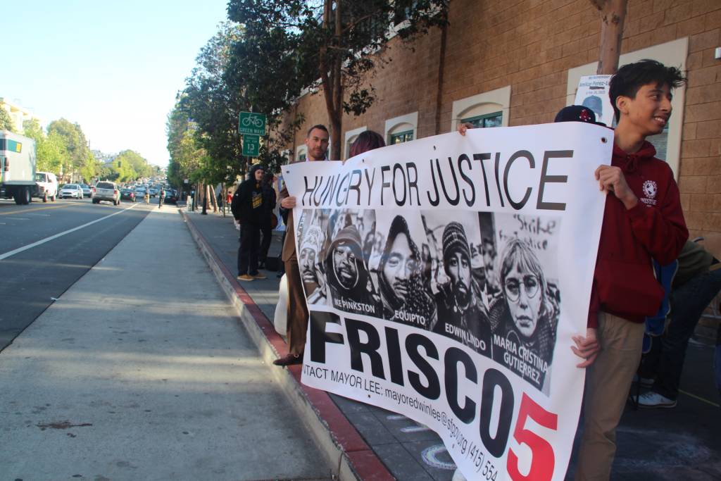 Supporters brought in a poster to show solidarity. Original Photo by Jessica Christian, SF Examiner