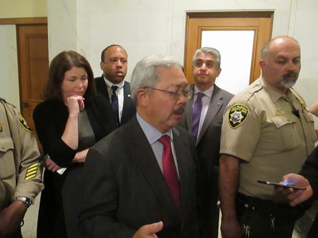 Mayor Lee talks with reporters after the board meeting