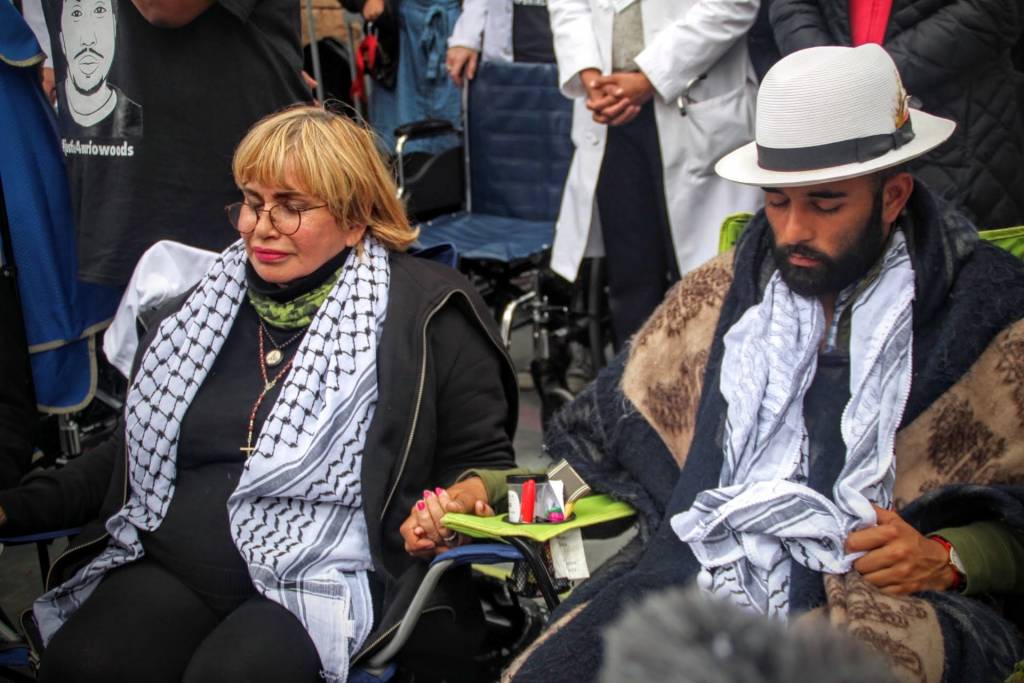 Edwin Lindo & Maria Cristina Gutierrez hold hands ahead of the March. Photo by Sana Saleem