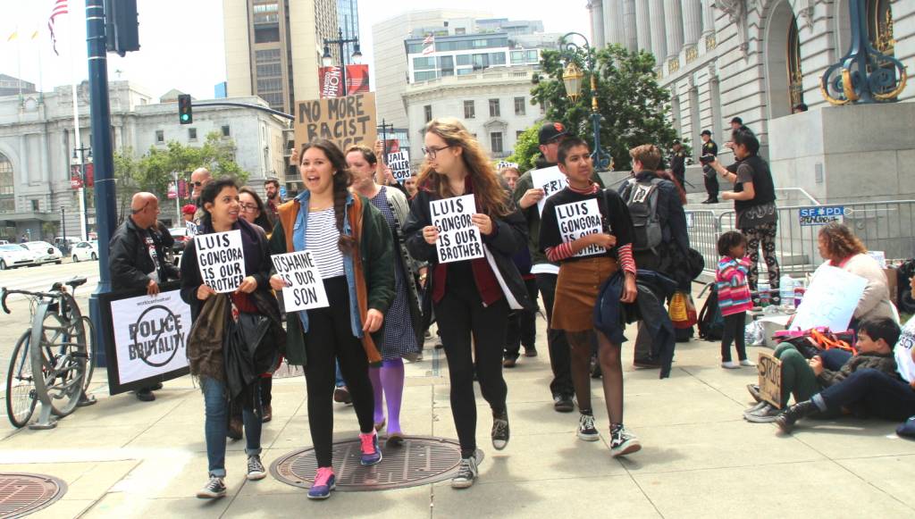 Protestors march around city hall on Monday - Photo by Sana Saleem