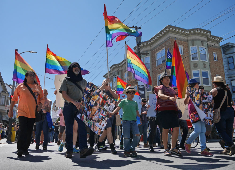 The 'Amor y Solidad' march from the Castro to the Mission on Saturday, June 18.