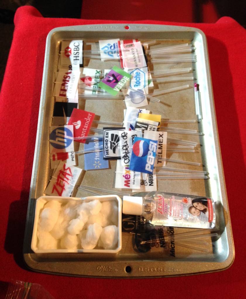 A tray of corporate acupuncture supplies waits at La Pocha's Mexico City performance last week. Photo by Caitlin Donohue