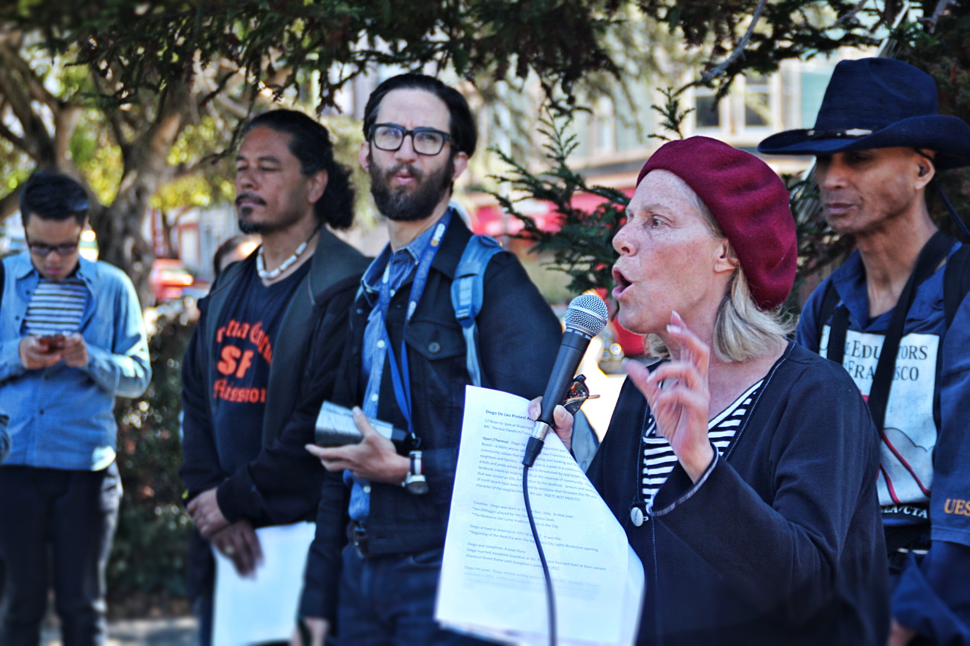 Theresa Flandrich speaks at a rally protesting the eviction of Diego Deleo at Washington Square Park in July. Photo by Sana Saleem. 