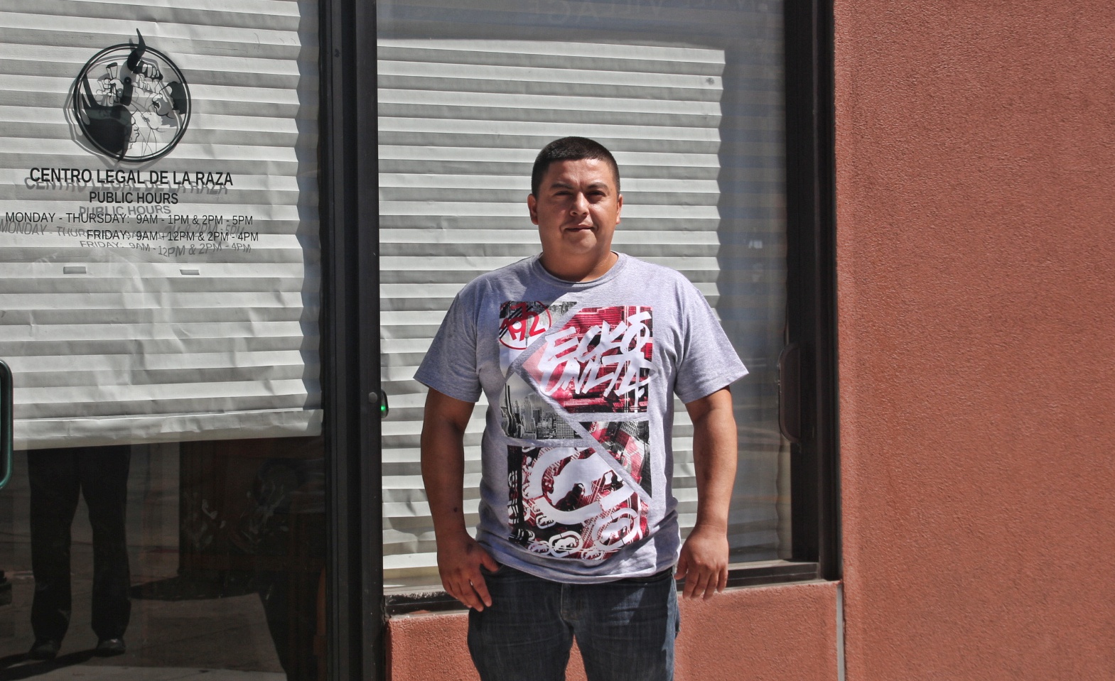 William Navarette stands infront of Centro Legal de la Raza office in Oakland. Photo by Sana Saleem