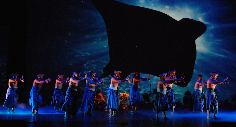 A manta ray hovers over a dance