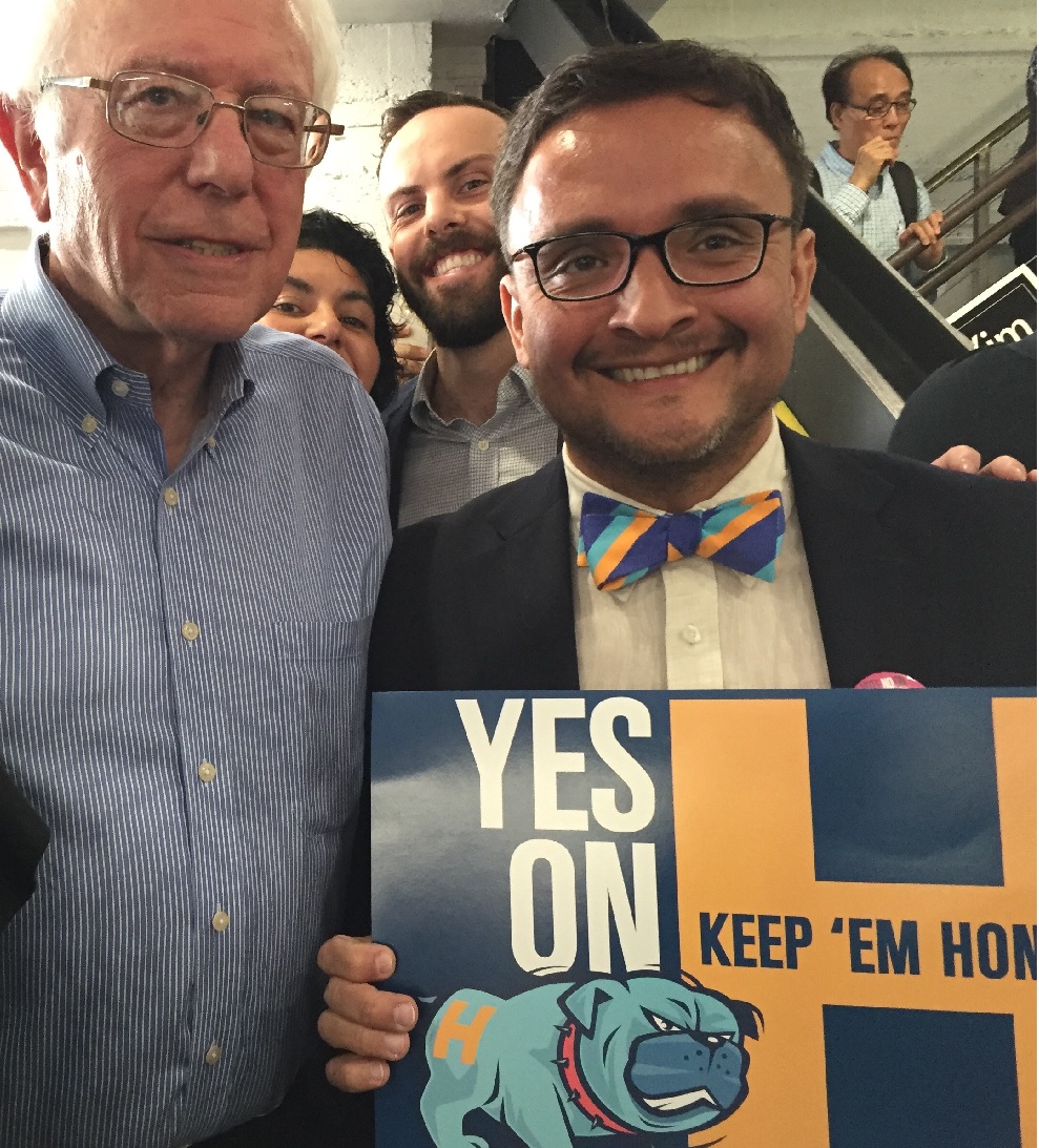 Bernie stands next to Sup. David Campos and a Yes on H sign