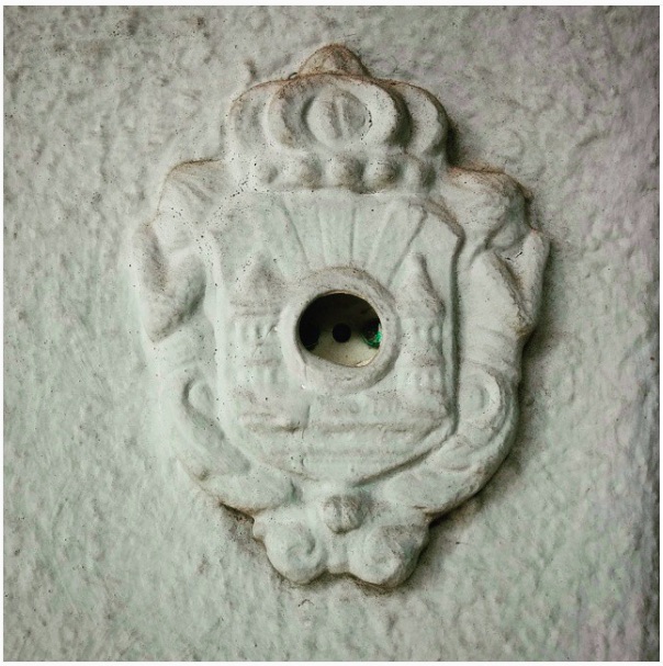 The ornate, broken doorbell outside Weidenbaum's home. "The vestigial doorbell. The doorbell emeritus." 