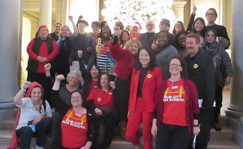 Supporters of Free City College celebrate after a 9-1 vote