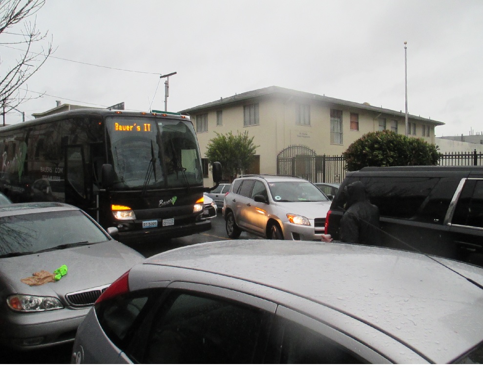 A Bauer's bus blocks traffic on 18th St as it waits to unload Chiu supporters