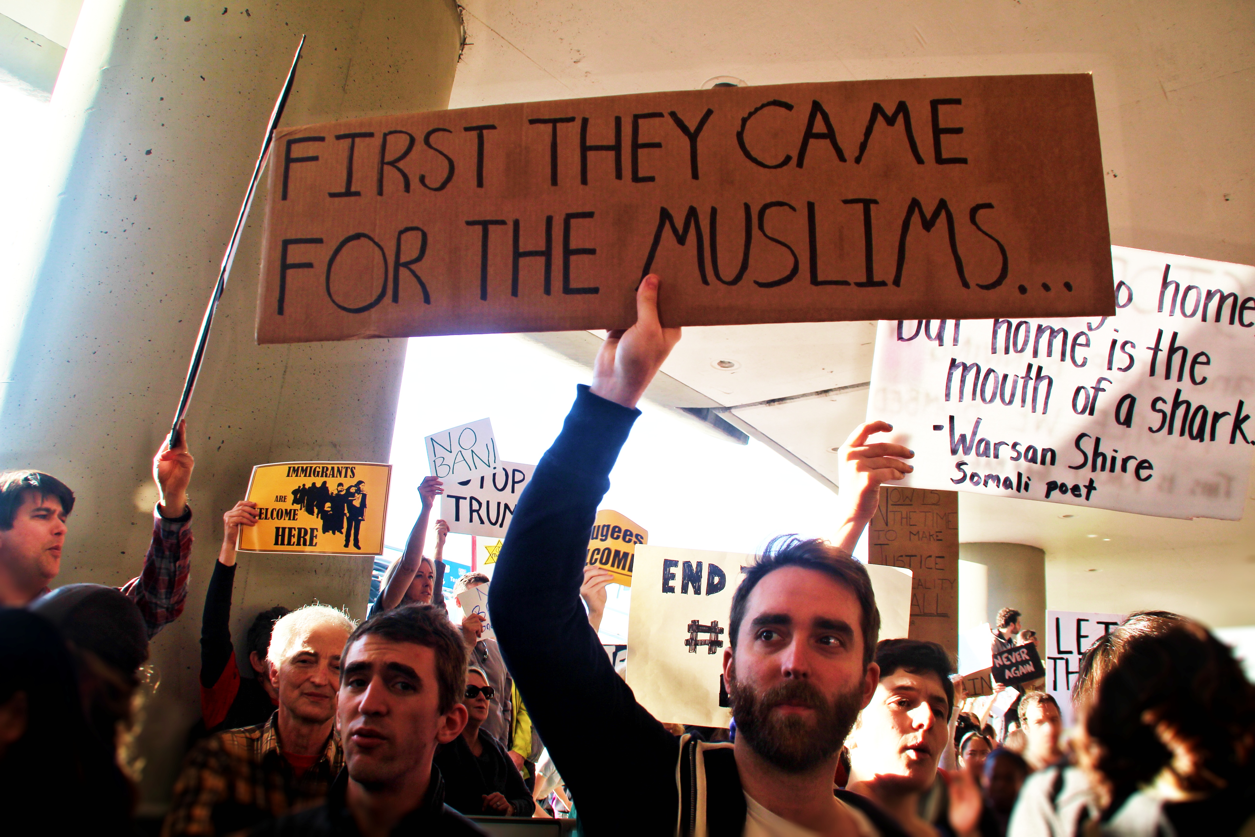 Protestors stand outside International Arrives at San Francisco International Airport to protest President Trump's Executive Order on immigration, barring individuals with legal visas from entering the United States, on Saturday 28th of January 2017.  Photo by Sana Saleem.