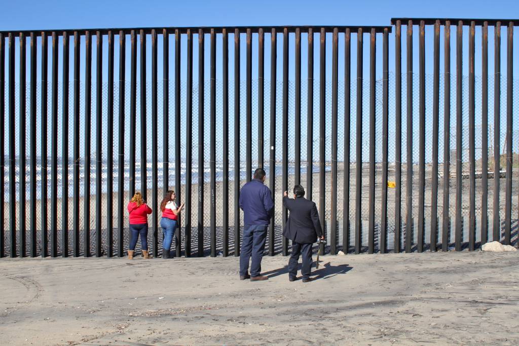 On the Tijuana side of the US-Mexico border, residents gaze across a wall that Trump says we have to build. Photo by Matthew Suarez